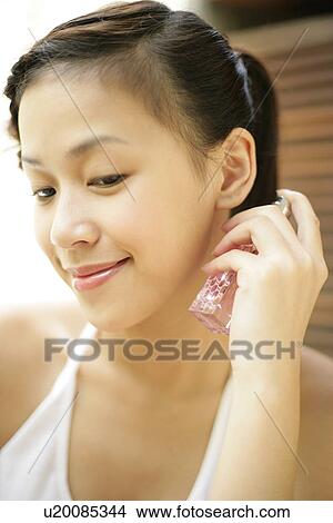 Woman with a spray. View Large Photo Image Picture - Woman with a spray.. Fotosearch