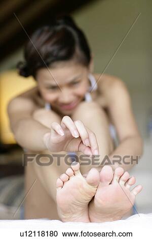 Stock Image - View of a young woman.. Fotosearch