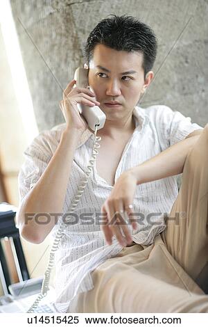 A man talking on the phone. View Large Photo Image Stock Photography - A man talking on the phone.. Fotosearch