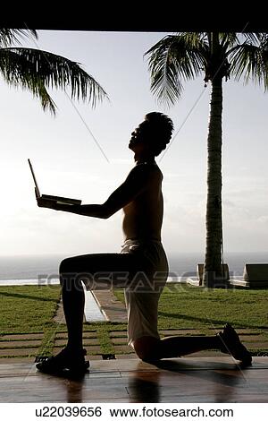 A man with a laptop. View Large Photo Image Stock Photograph - A man with a laptop.. Fotosearch