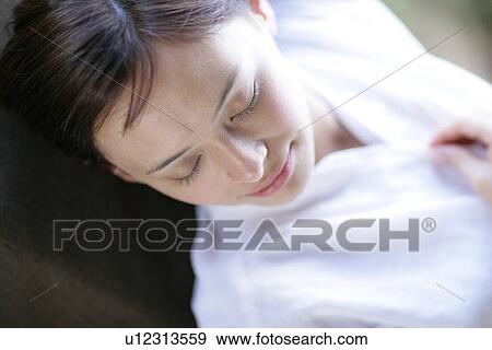 Close-up of a young woman sleeping. View Large Photo Image Stock Photo - Close-up of a young woman sleeping.. Fotosearch