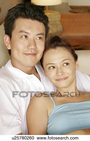 Stock Image - View of a couple smiling.. Fotosearch