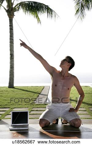 View of a man kneeling and hand raised. View Large Photo Image Stock Photo - View of a man kneeling and hand raised.. Fotosearch