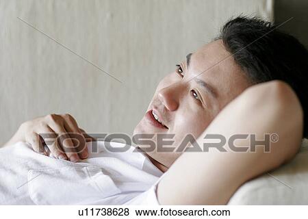 View of a man lying. View Large Photo Image Stock Photo - View of a man lying.. Fotosearch