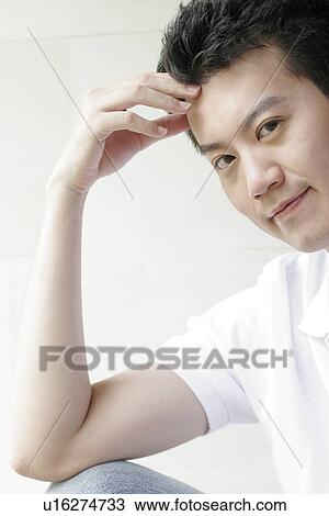 Stock Image - View of a man staring.. Fotosearch