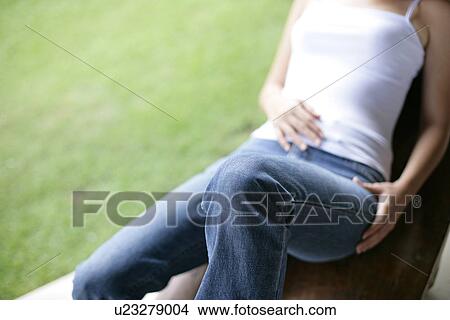 View of a woman lying on a bench. View Large Photo Image Picture - View of a woman lying on a bench.. Fotosearch