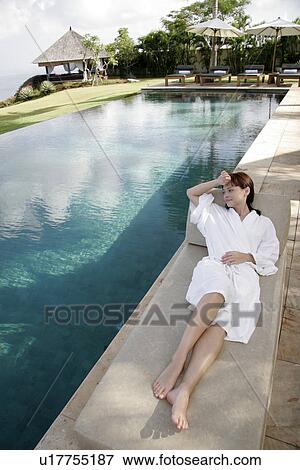 View of a woman lying on the deck chair. View Large Photo Image Stock Photo - View of a woman lying on the deck chair.. Fotosearch