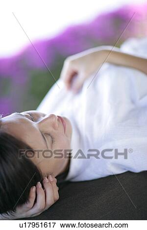 Stock Photo - View of a woman lying.. Fotosearch