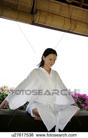 View of a woman sitting with cross legged. View Large Photo Image Stock Photo - View of a woman sitting with cross legged.. Fotosearch