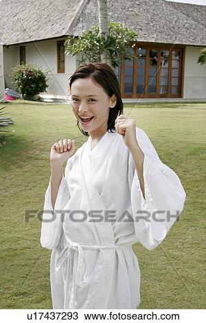 Stock Image - View of a woman smiling.. Fotosearch