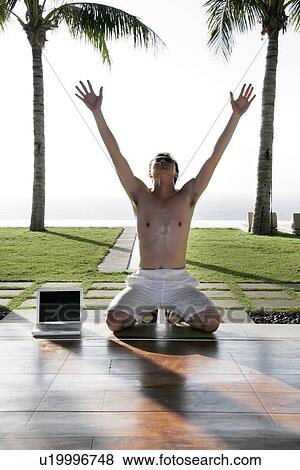 View of a young man kneeling. View Large Photo Image Stock Photo - View of a young man kneeling.. Fotosearch