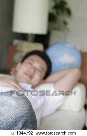 View of a young man resting. View Large Photo Image Stock Image - View of a young man resting.. Fotosearch
