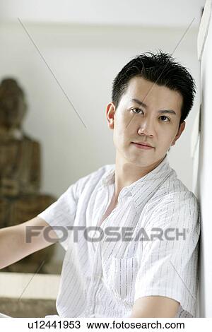 Stock Image - View of a young man staring.. Fotosearch