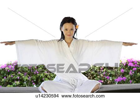 View of a young woman performing yoga. View Large Photo Image Picture - View of a young woman performing yoga.. Fotosearch
