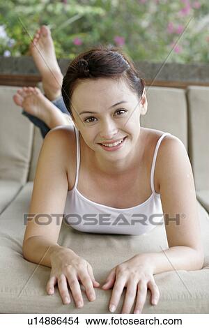 Woman smiling towards camera. View Large Photo Image Picture - Woman smiling towards camera.. Fotosearch