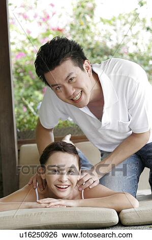 Stock Photograph - Young couple smiling.. Fotosearch
