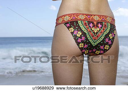 Rear view of a woman wearing a colorful panty. View Large Photo Image Stock Photo - Rear view of a woman wearing a colorful panty.. Fotosearch