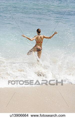 Picture - View of a woman bathing.. Fotosearch