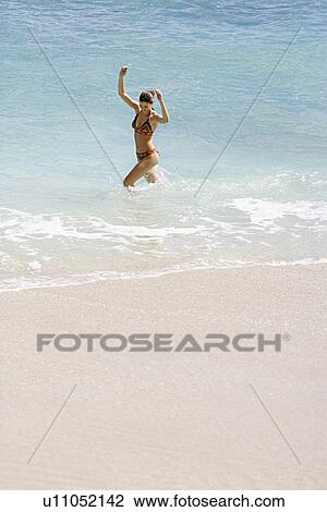 View of a woman bathing. View Large Photo Image Stock Image - View of a woman bathing.. Fotosearch