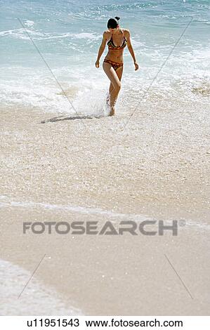 View of a woman bathing. View Large Photo Image Stock Image - View of a woman bathing.. Fotosearch