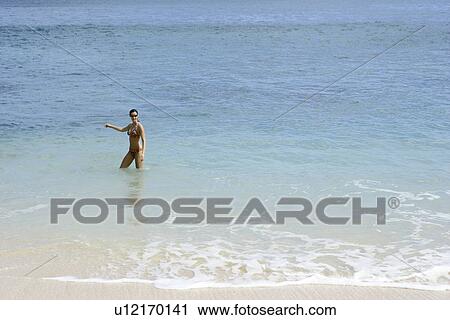 View of a woman bathing. View Large Photo Image Stock Image - View of a woman bathing.. Fotosearch