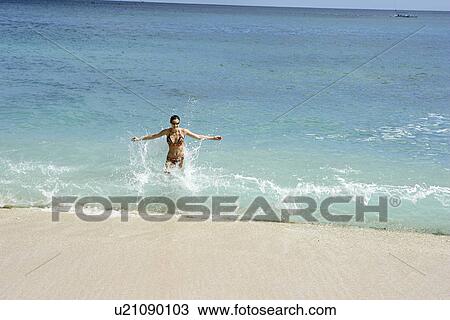 View of a woman bathing. View Large Photo Image Stock Image - View of a woman bathing.. Fotosearch