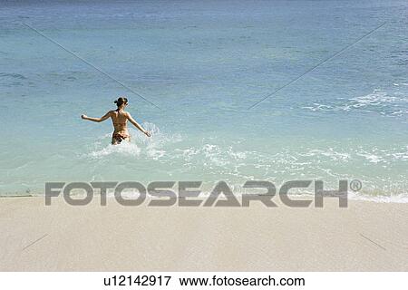 View of a woman bathing. View Large Photo Image Stock Photo - View of a woman bathing.. Fotosearch