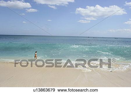 Stock Photo - View of a woman bathing.. Fotosearch