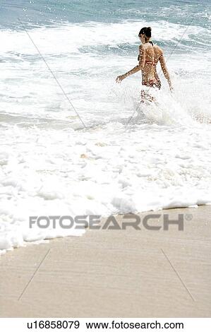 View of a woman bathing. View Large Photo Image Stock Photo - View of a woman bathing.. Fotosearch