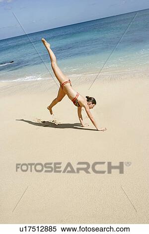 View of a woman performing acrobatic feat. View Large Photo Image Stock Photography - View of a woman performing acrobatic feat.. Fotosearch