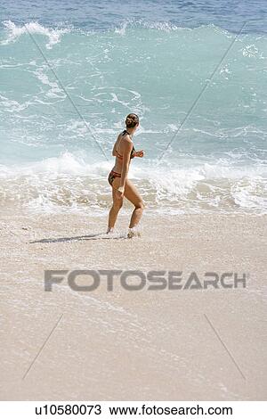 View of a woman walking. View Large Photo Image Stock Image - View of a woman walking.. Fotosearch