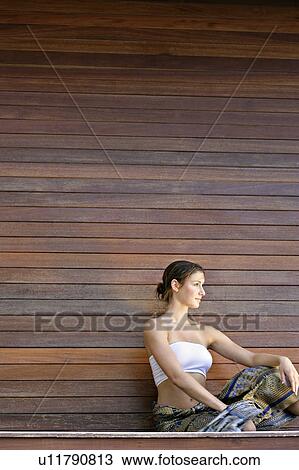 A woman sitting in a pose. View Large Photo Image Stock Image - A woman sitting in a pose.. Fotosearch