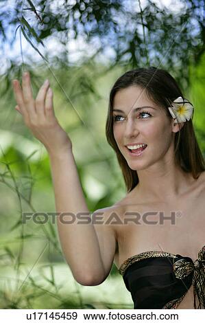 Stock Photo - Close-up of a beautiful young woman.. Fotosearch