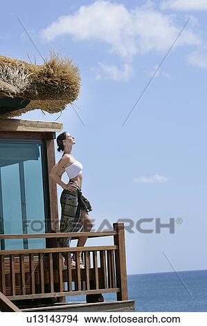 Picture - Side view of a beautiful young woman.. Fotosearch