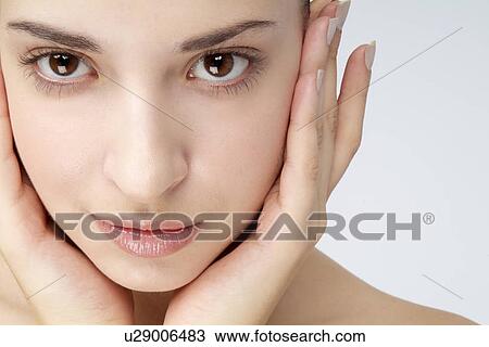 Stock Image - Close-up of a young woman.. Fotosearch