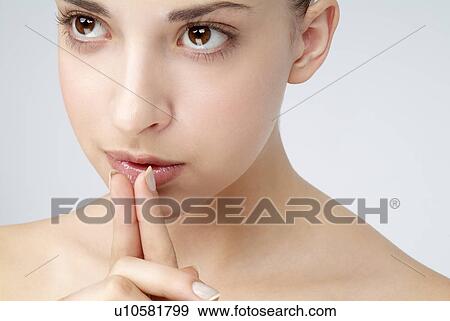 Stock Photo - Close-up of a young woman.. Fotosearch