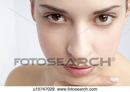 Stock Photo - Close-up of a young woman.. Fotosearch