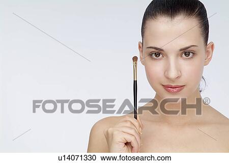 View of a woman holding eyebrow pencil. View Large Photo Image Stock Image - View of a woman holding eyebrow pencil.. Fotosearch