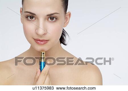View of a woman with a lipstick View Large Photo Image Stock Image - View of a woman with a lipstick. Fotosearch