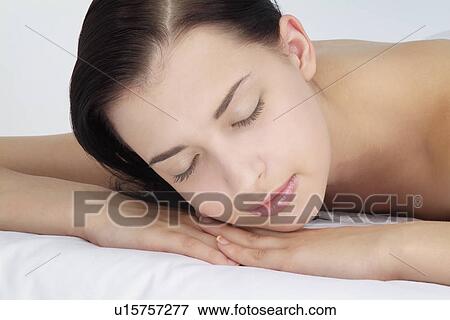 Close-up of a woman relaxing. View Large Photo Image Stock Photo - Close-up of a woman relaxing.. Fotosearch