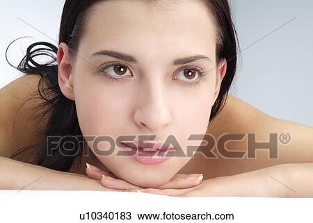 Stock Image - Close-up of a young woman.. Fotosearch