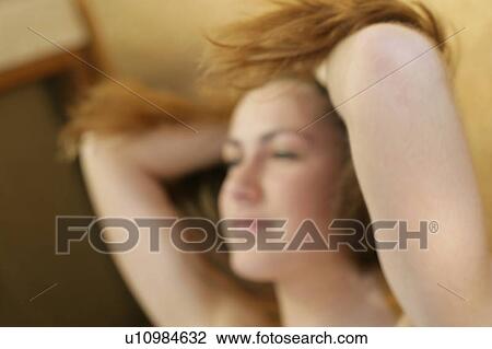A woman handling her hair. View Large Photo Image Stock Image - A woman handling her hair.. Fotosearch