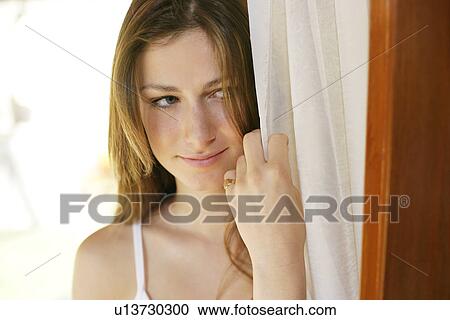 A woman holding curtain. View Large Photo Image Stock Image - A woman holding curtain.. Fotosearch