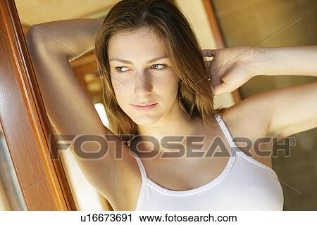 Stock Image - A woman looking away.. Fotosearch