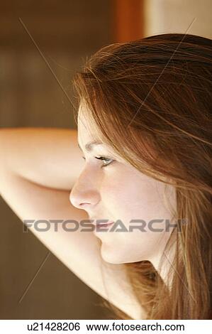 Stock Photograph - Close-up of a young woman.. Fotosearch