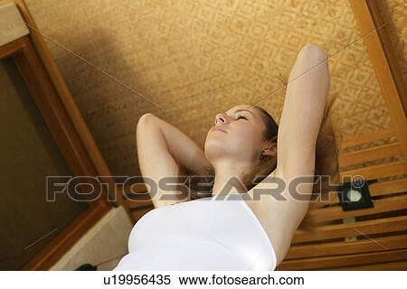 Low angle view of a young woman. View Large Photo Image Stock Photography - Low angle view of a young woman.. Fotosearch