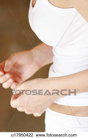Midsection of a young woman. View Large Photo Image Stock Image - Midsection of a young woman.. Fotosearch