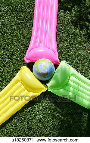 Stock Image - Colorful floats on a lawn.. Fotosearch