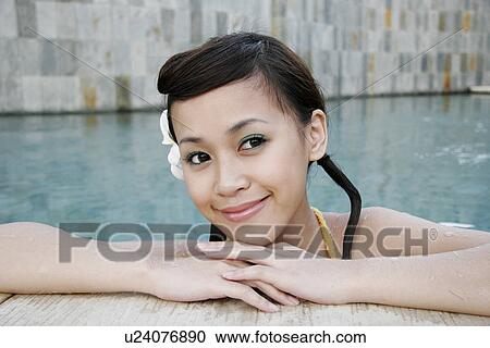 Portrait of a teenage girl in swimming pool. View Large Photo Image Stock Image - Portrait of a teenage girl in swimming pool.. Fotosearch