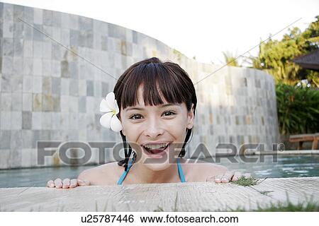 Portrait of a teenage girl leaning by a swimming pool. View Large Photo Image Stock Photograph - Portrait of a teenage girl leaning by a swimming pool.. Fotosearch